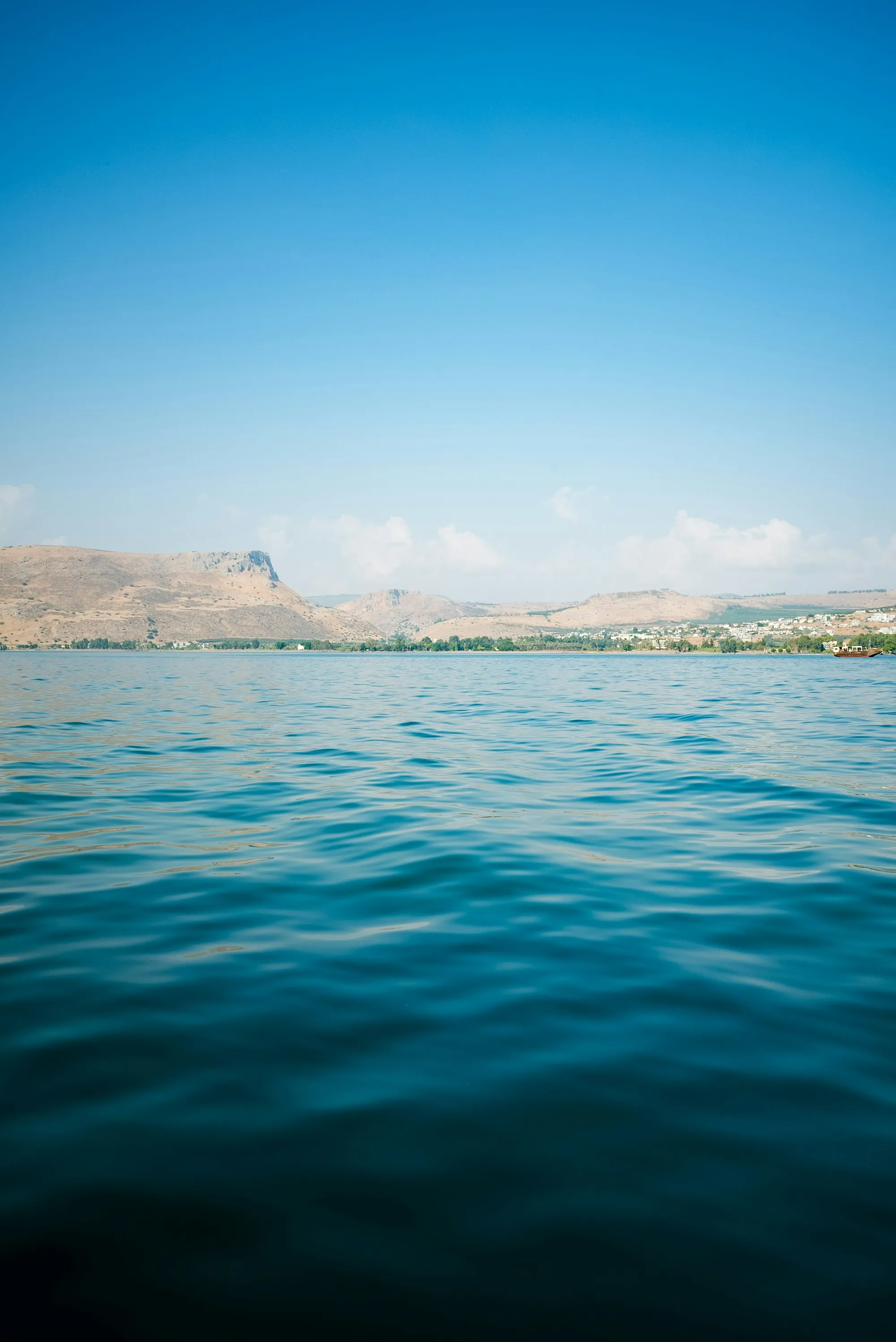 Calm water with hills behind